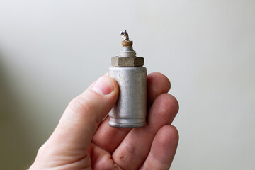 An old electrolytic capacitor. Old radio parts.