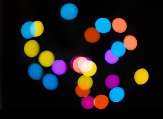 Christmas isolated light blur on black backdrop. Abstract festive overlay or background with text space