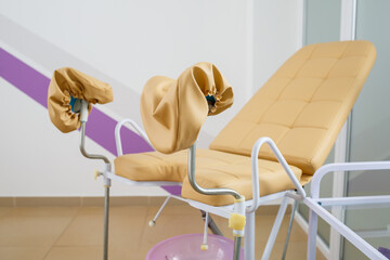 Modern gynecological examination chair for women. Medical chair in the gynecologist's office
