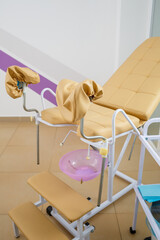 Modern gynecological examination chair for women. Medical chair in the gynecologist's office
