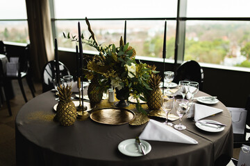 designer table set in an event golden pineapples dishes  