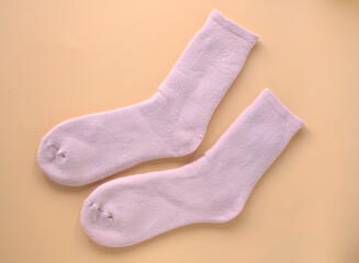 Fototapeta na wymiar Pink socks to be at home. Autumn-winter season