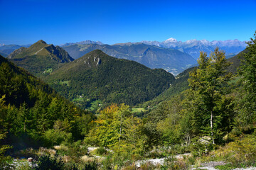 On the way to Monte Guglielmo. View to Corna Trentapassi and far to the Alps. Brescia, Lombardy, Italy.