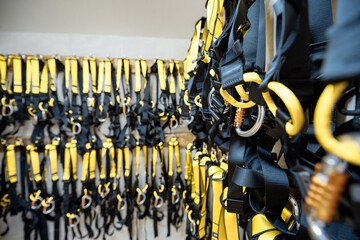 Professional climbing equipment hanging at amusement park warehouse