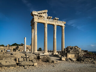 The ruins and columns of majestic Apollo temple in Side Antalya Turkey with a blue sunny sky background