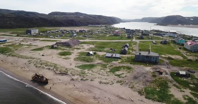 Aerial view of village on shore of Barents Sea. High quality 4k footage