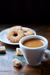 Cup of coffee on rustic wooden background. Close up.	