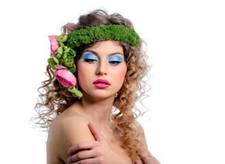 Beautiful young girl with bright makeup and flowers in a curly hair. Blue eye shadow and red lipstick.