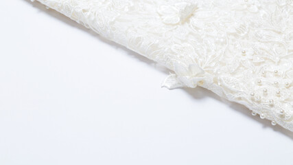 White luxurious guipure. Fabric for sewing a wedding dress. textile wedding background with beads. elegant wallpaper