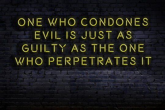 Wise quote. Neon inscription against brick wall