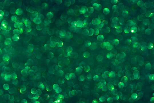 green glitter texture background. Selective focus.Dark emerald