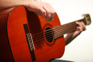Man playing an classic acoustic guitar