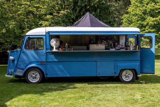 Legendary French Citroen Type H van in a park providing snacks to customers