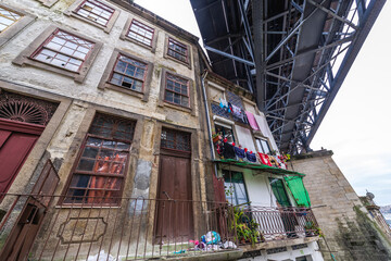 Residential buildings under the steel bridge of Dom Luis I in Porto, Portugal