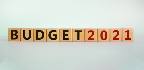 Business concept of starting 2021. Wooden cubes with word 'Budget 2021'. Beautiful white...