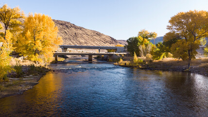 Drone point of view over the Truckee river as it passes under bridges near highway I80