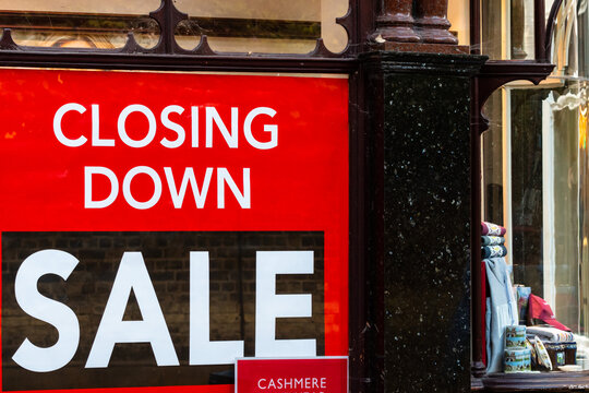 Closing Down Sale poster on a clothing store window due to covid-19