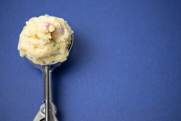 raw cookie dough in an ice cream scoop 