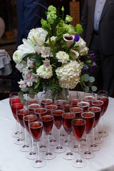 Welcome drinks. Red sparcling welcome drinks on a table served in champagne glass.