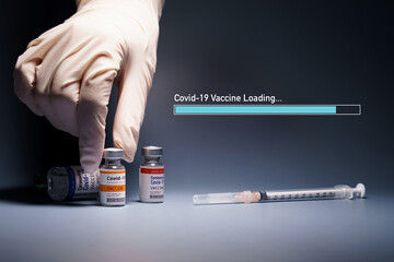 Covid-19 Vaccine Research and Development progress - Global trial phase 3 concept. Hand of a...