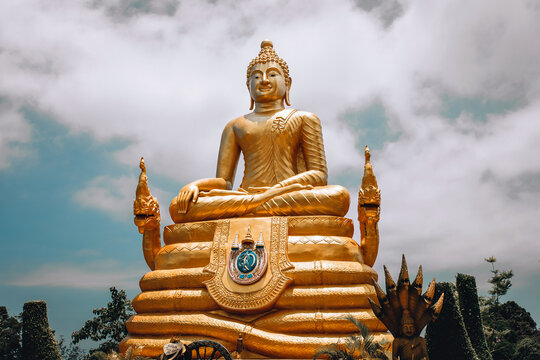 Enormous huge golden buddha statue in lotus position, sculpture, buddhism