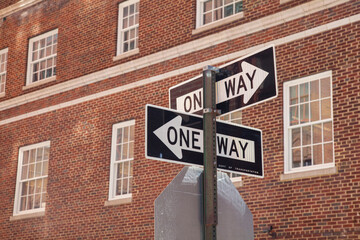 Traffic signs on the background of the building. Two arrows 
