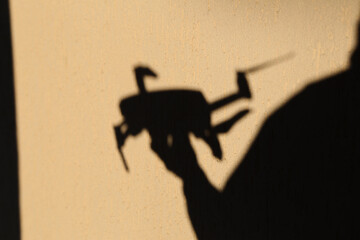 Drone in hand silhouette