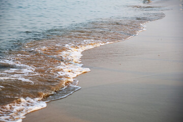 Beautiful soft wave sea and sand in the morning at Pattaya, Thailand.
