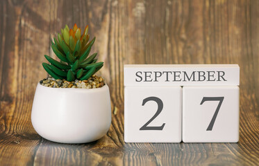 Flower pot and calendar for the cool season from 27 September. Autumn time.