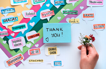 Thank You in many languages. Paper art, creative flat lay, top view on paper tags. International...
