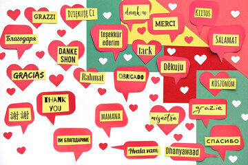 Thank You in many languages. Paper art, creative flat lay, top view on paper tags. International...