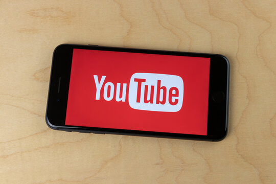 YouTube Icon On A Smartphone. YouTube And Creators Earn Advertising Revenue From Google AdSense.