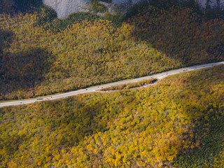 Interstate Highway I-93 with fall foliage aerial view in Franconia Notch State Park in White Mountain National Forest, near Lincoln, New Hampshire NH, USA. 