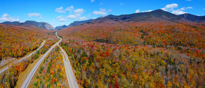 Interstate Highway I-93 across Franconia Notch panorama between Cannon Mountain and Mount Lafayette with fall foliage in Franconia Notch State Park in White Mountain, Lincoln, New Hampshire NH, USA. 