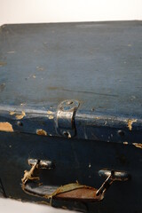 An old suitcase about 40 years of the 19th century. Dark blue color and protected corners with metal inserts. Two locks. Big.