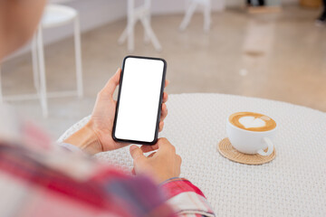 cell phone blank white screen mockup.woman hand holding texting using mobile on desk at office.background empty space for advertise.work people contact marketing business,technology