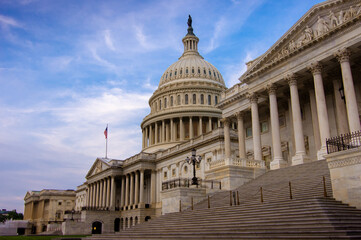 Low angle view of the east entrance to United States Capitol building in Washington DC with marble...