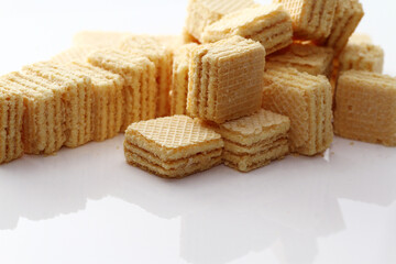 Lemon cream cube wafer on white background