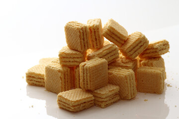 Lemon cream cube wafer on white background