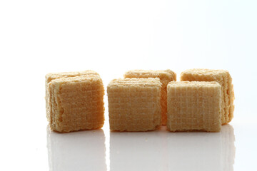 Lemon cream cube wafer on white background