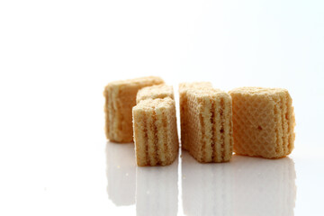 Lemon cream cube wafer on white background
