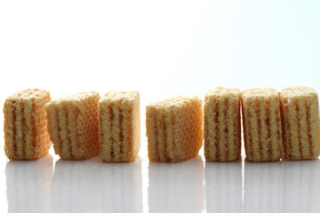 Lemon cream cube wafer on white background