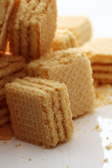 Lemon cream cube wafer on white background