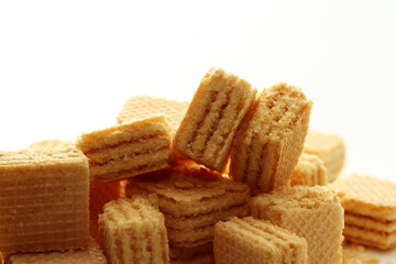 Lemon cream cube wafer on white background