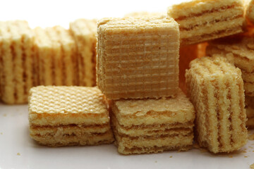 Lemon cream cube wafer on white background
