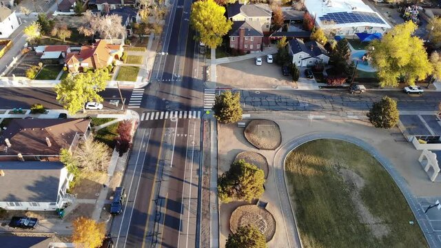  Drone perspective tilt up tp downtown Reno looking North on a clear day with light clouds and trees in fall color.