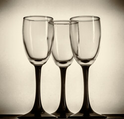 Three glasses of spirits on a white background.