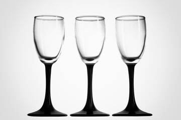 Three glasses of strong alcohol on a white background