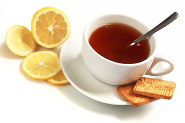 Hot drink with a lemon and cookies