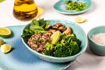Clean healthy detox eating. Vegan vegetarian food quinoa, spinach, broccoli, mushrooms and microgreens